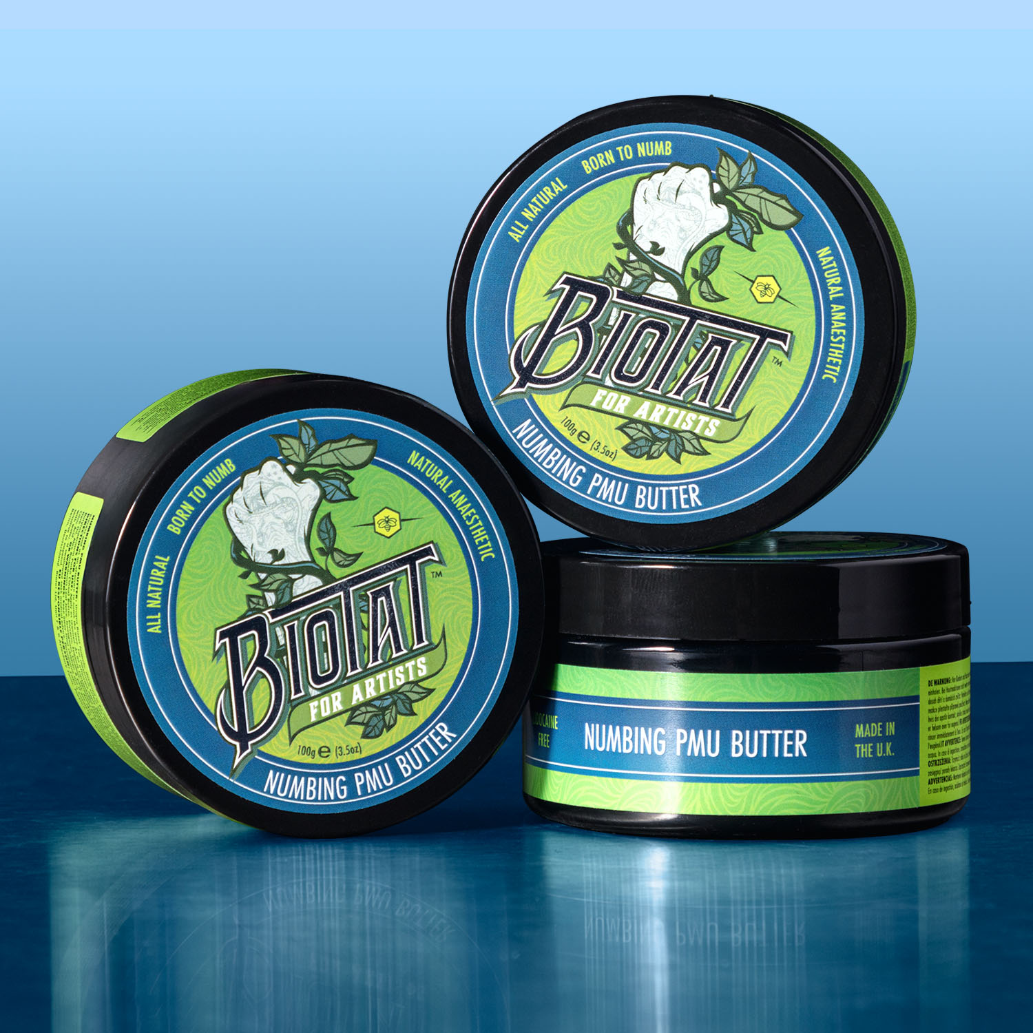 Trois pots de Biotat Numbing PMU Butter empilés les uns sur les autres